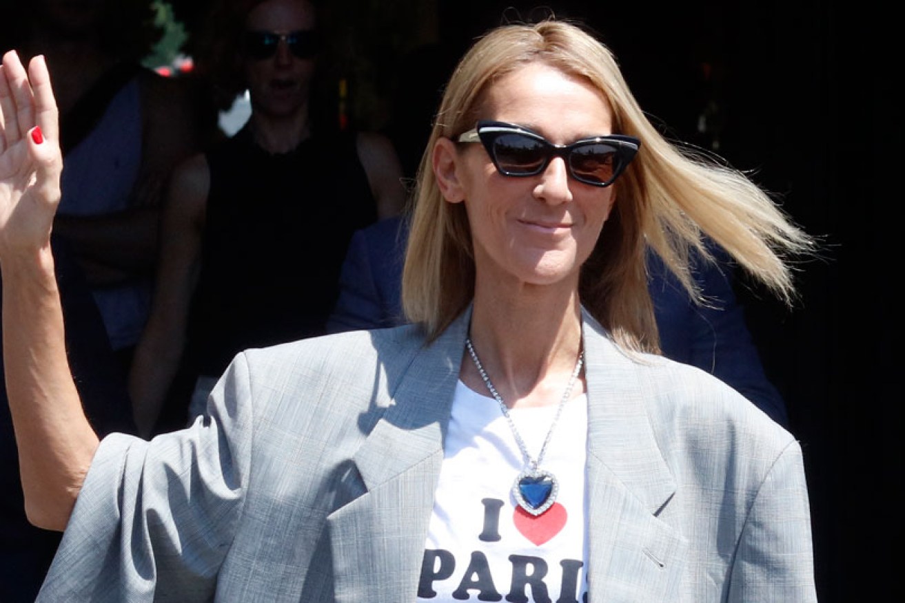 With necklace and T-shirt, Celine Dion shows her heart will go on in Paris on July 3.