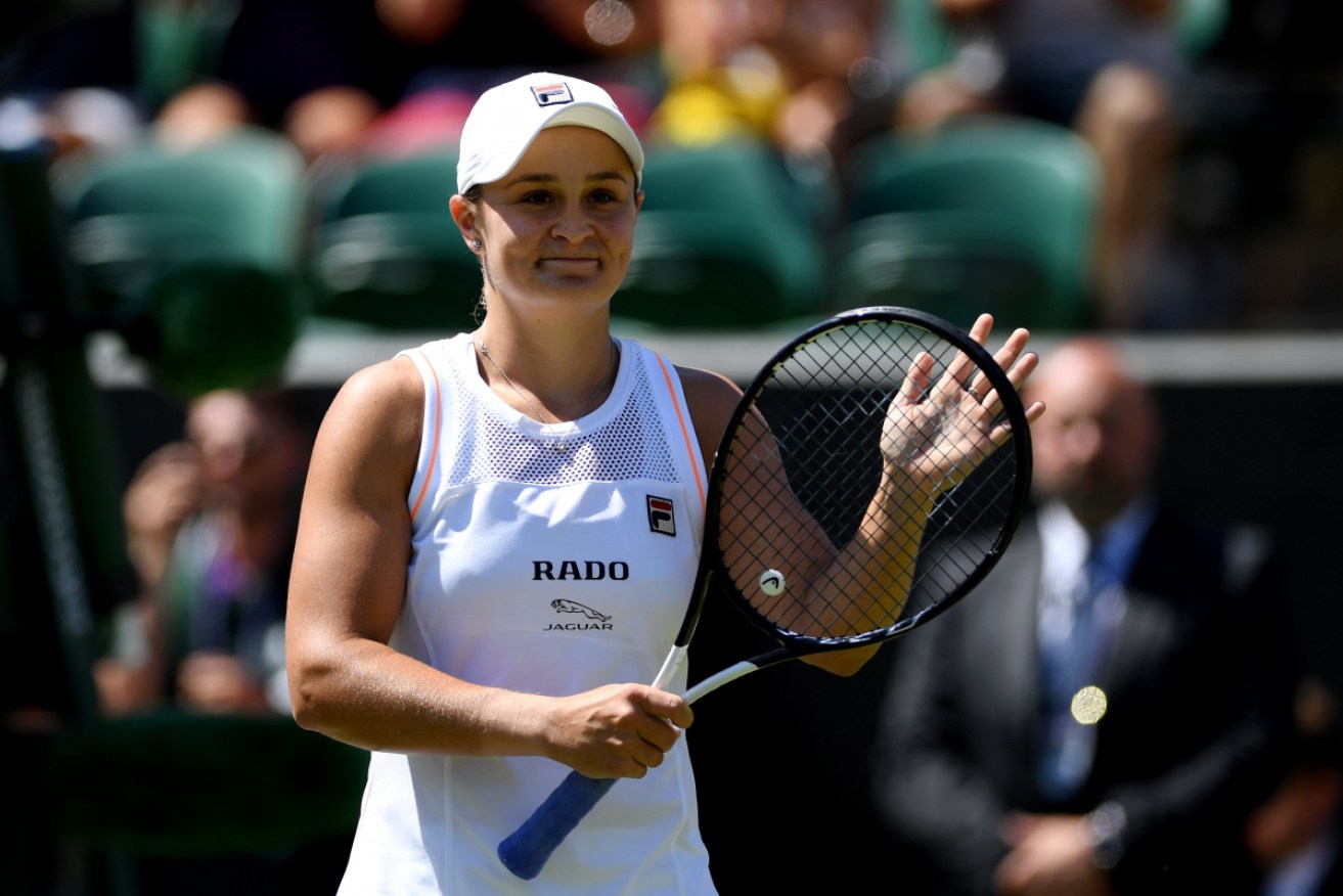 Ash Barty acknowledges the crowd after her second-round win over Alison Van Uytvanck at Wimbledon. 