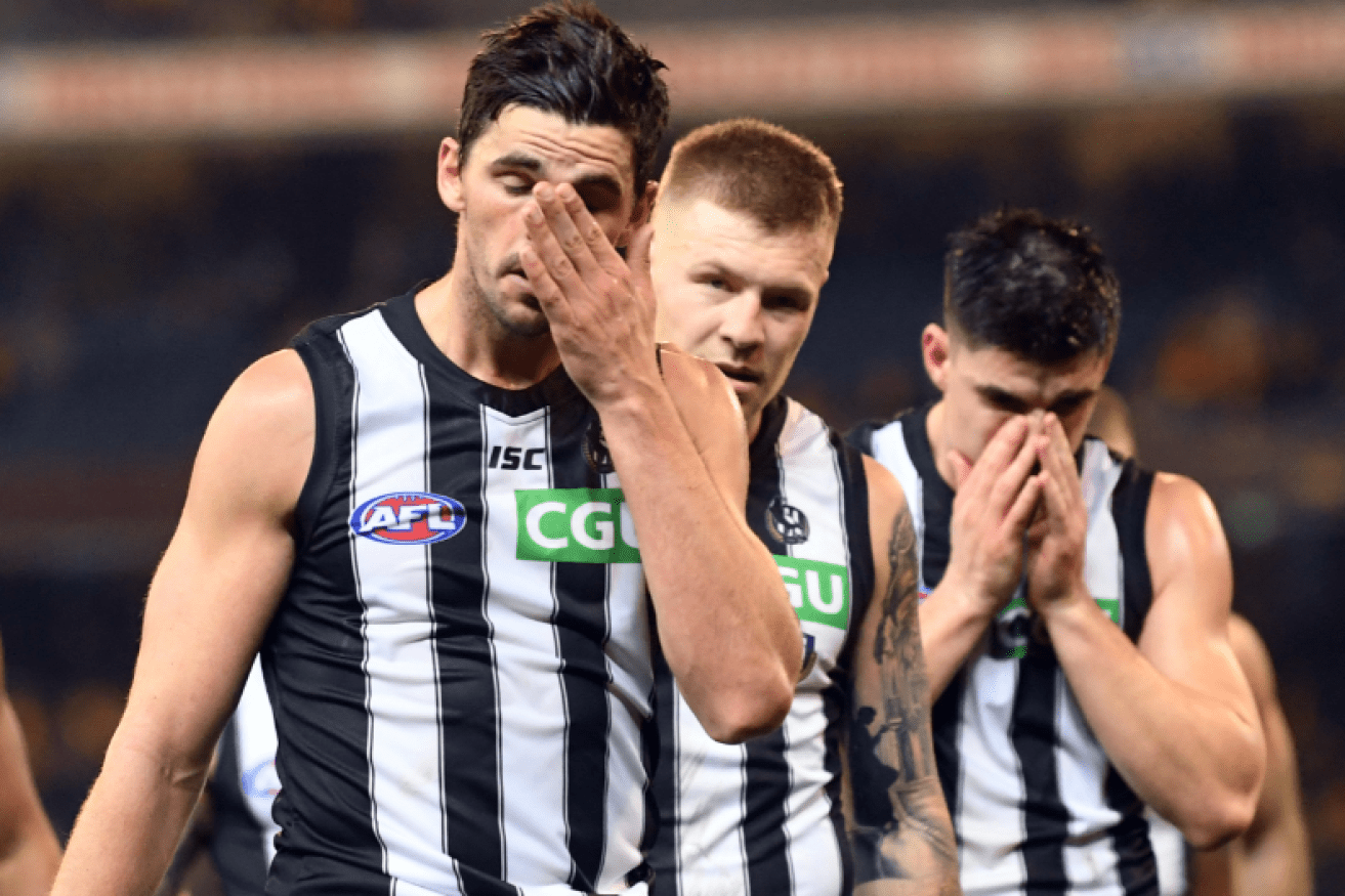 Crushed and crestfallen Magpies shuffle off the field after blowing yet another four-point opportunity.