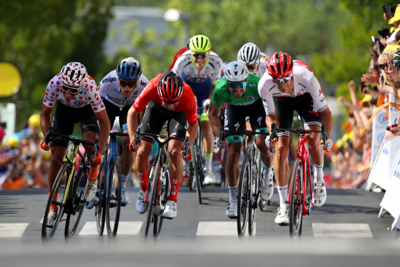 Australian Michael Matthews (centre, in red) during the third stage of the Tour de France.
