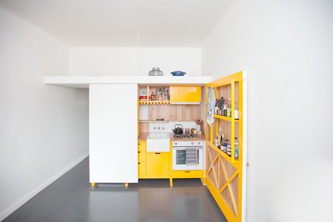 Architect Nicholas Agius used a fold-out kitchen bench-top to maximise space in his 23-square-metre Fitzroy apartment. 