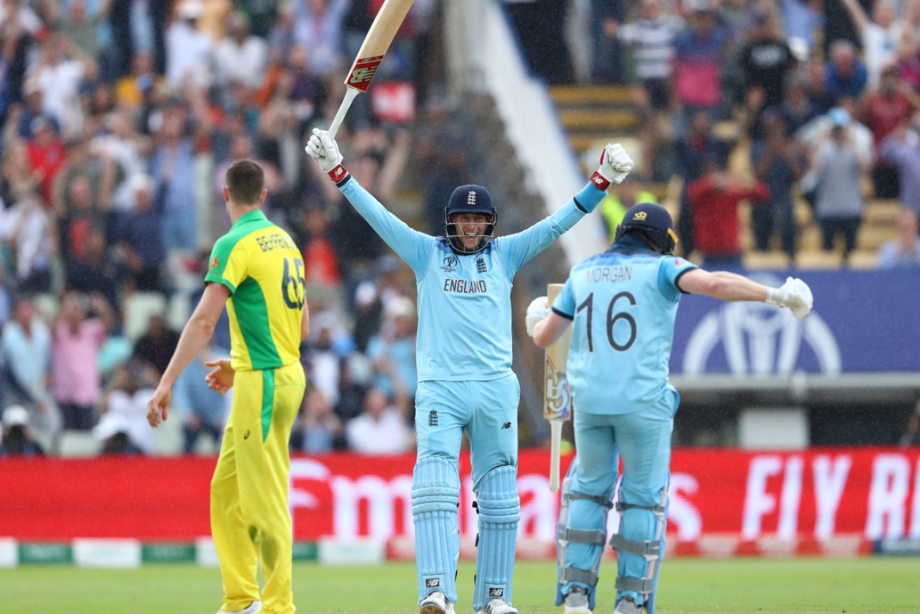 Joe Root of England celebrates as Eoin Morgan of England scores the winning runs to secure victory ov er Australia in the semi-final.