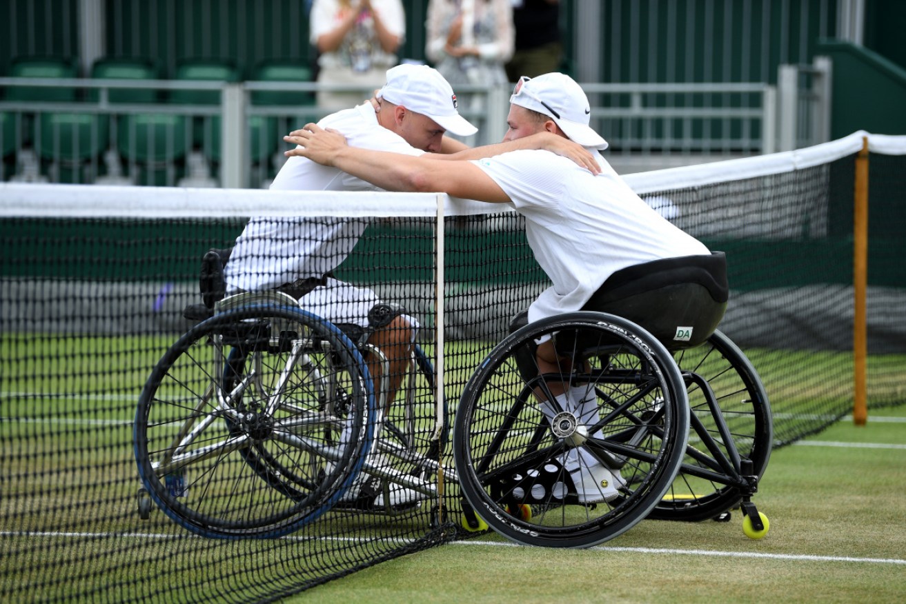 Australia's Dylan Alcott (R) hugs opponent Andy Lapthorne of Great Britain after the Quad Wheelchair final.  