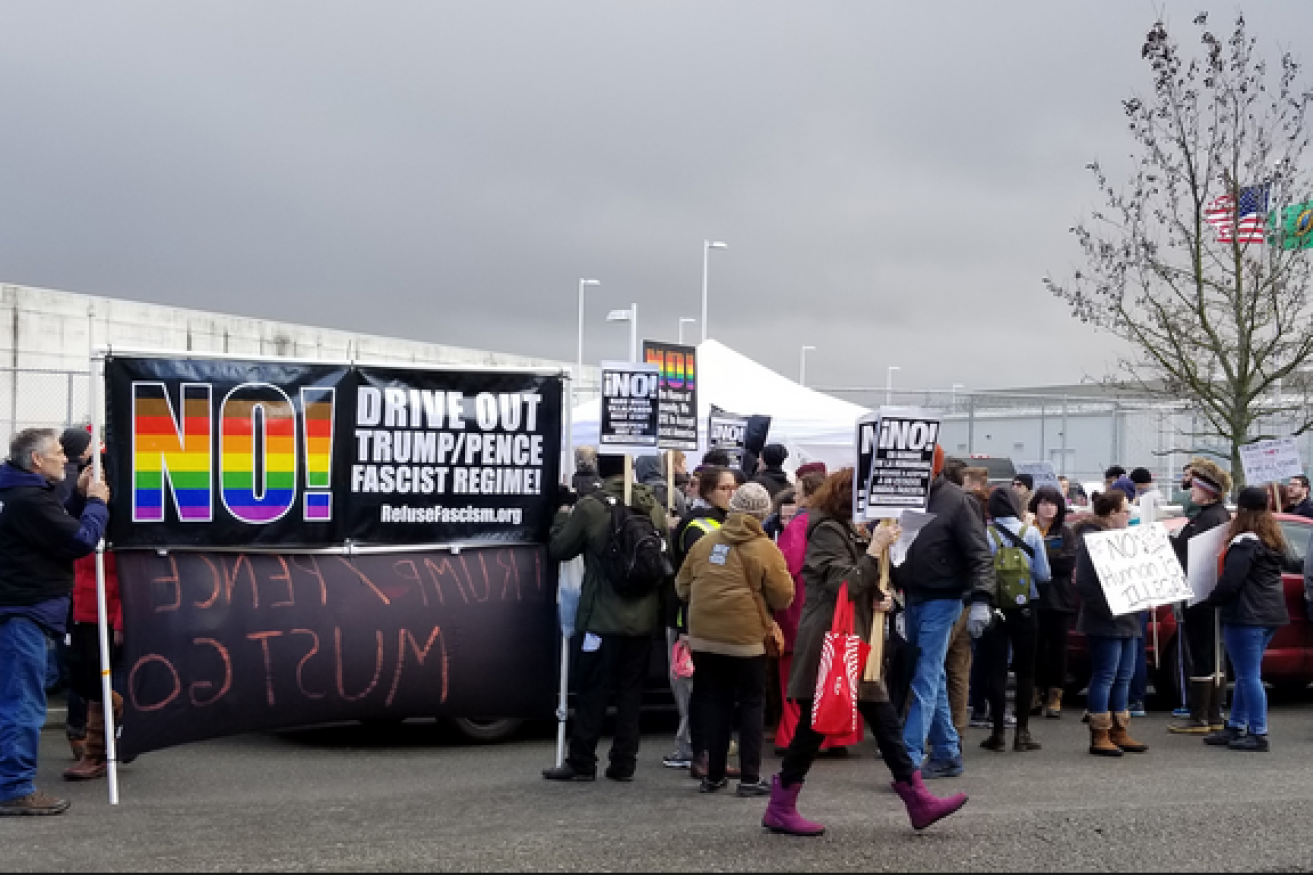 Protesters denounce Donald Trump's hard-line immigration policies outside the Tacoma detention centre.