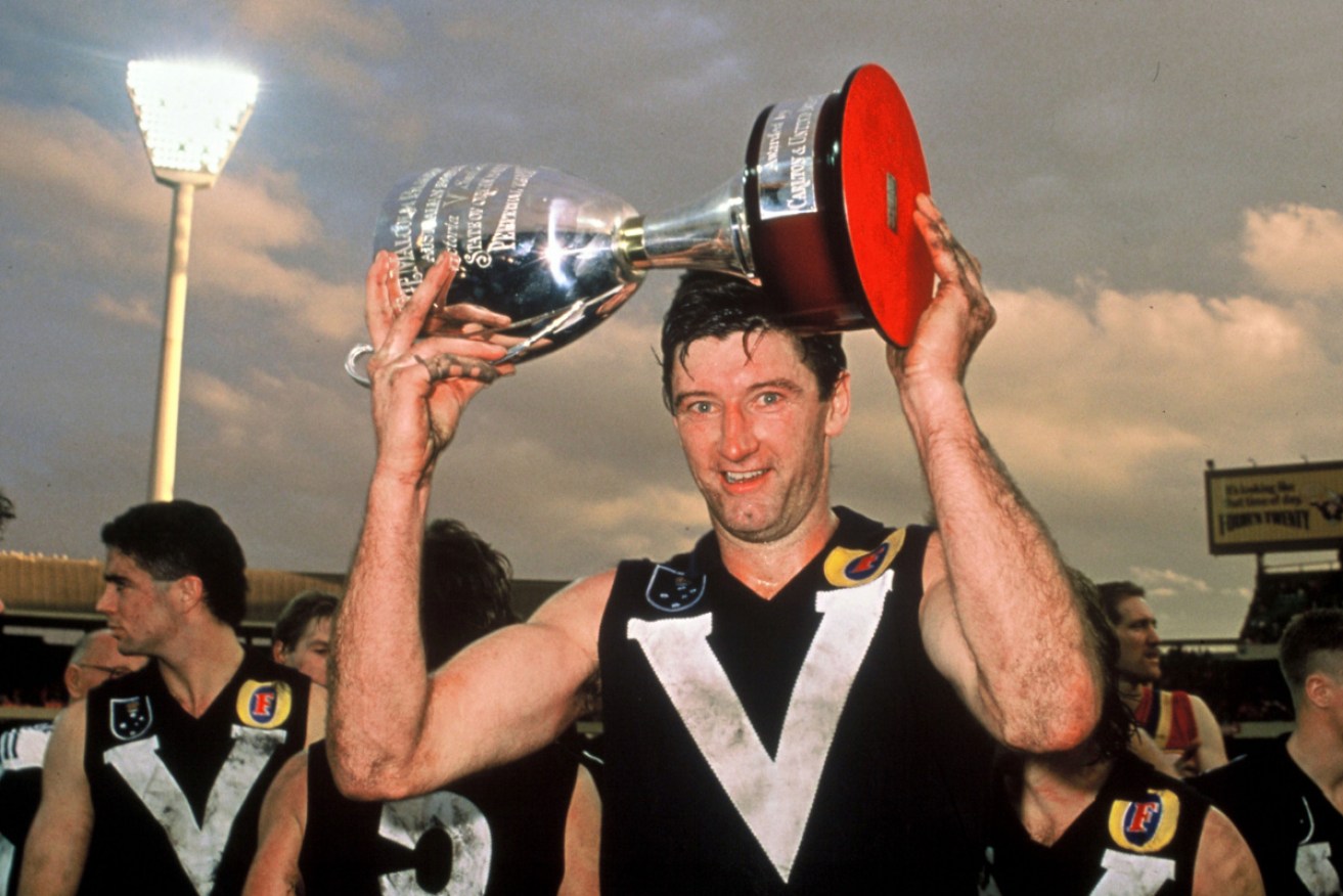 Simon Madden with the 1989 State of Origin trophy after Victoria defeated South Australia.