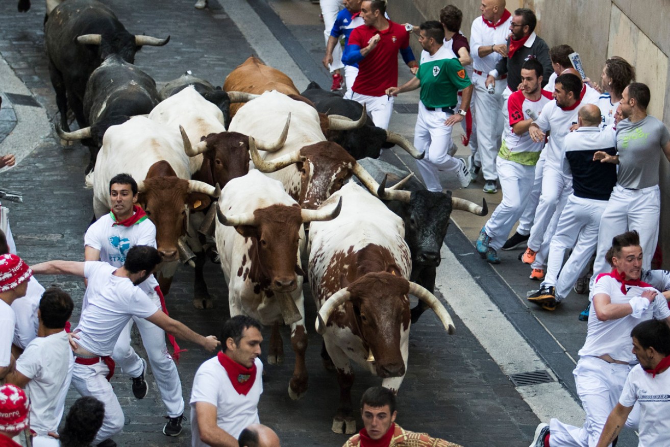 The Australians were among eight people injured in this year's bull runs.