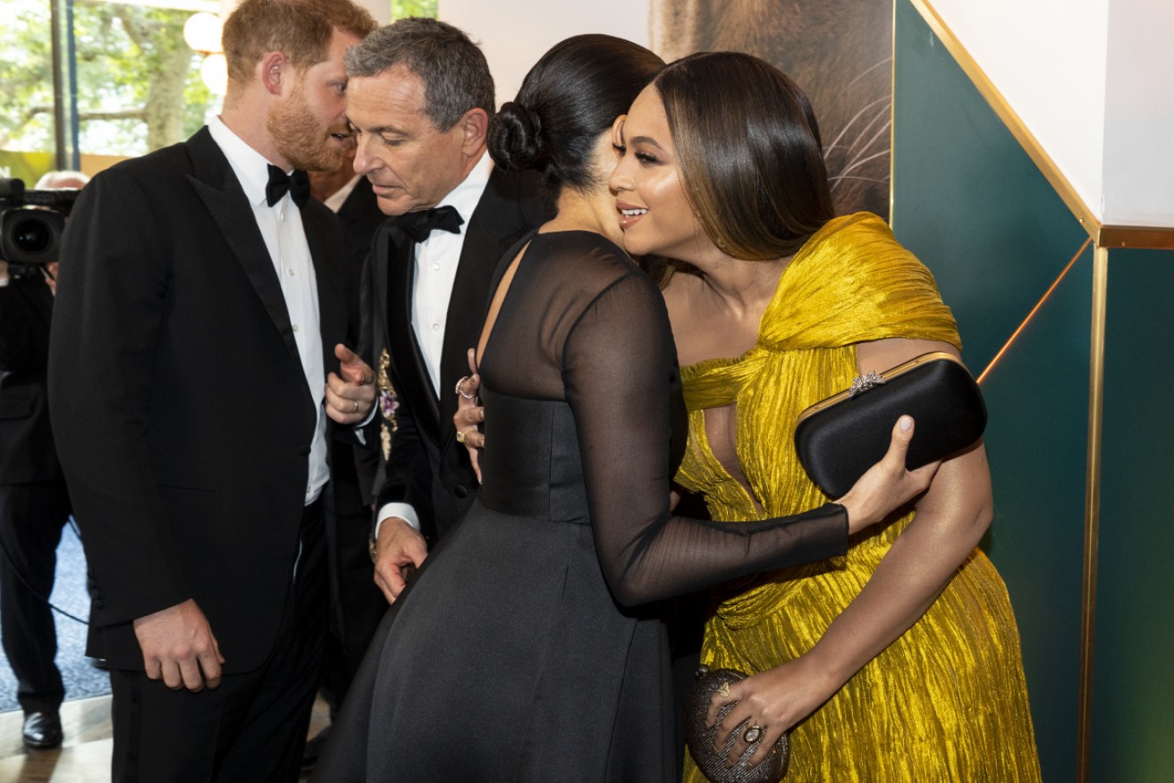When the duchess met the queen: Hugs all round between Meghan Markle and Beyonce.
