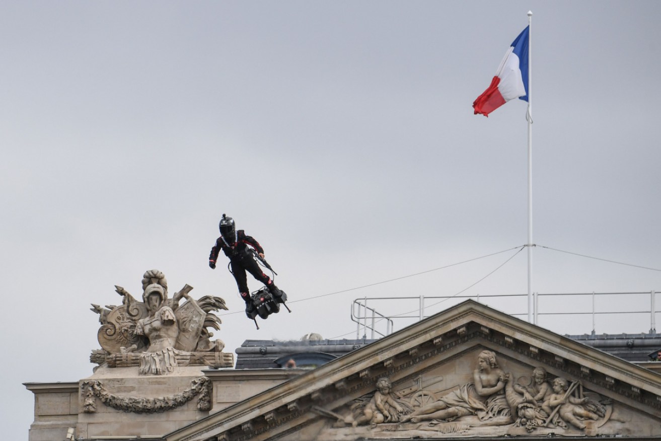 Franky Zapata soars above the Champs-Elysees on his flyboard.