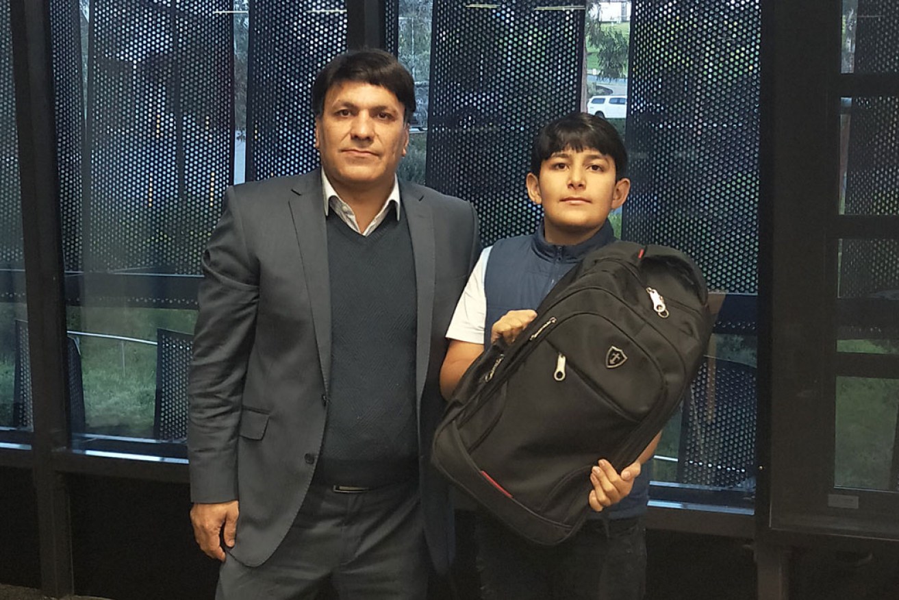  Engineer Hamid Abdi (left) was inspired to invent a 'smart' schoolbag after son Nikan (right) forgot to pack a school project.  