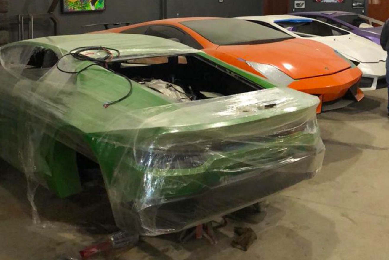 Police uncovered a garage of bootleg supercars, being pumped out and sold online by a father and son team.