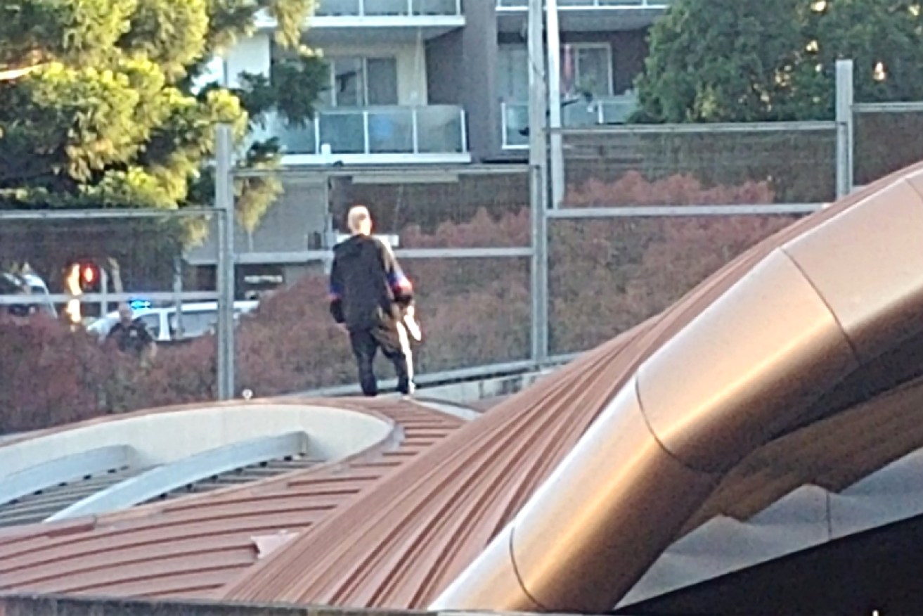 The man on the roof of the tunnel entrance on Thursday.
