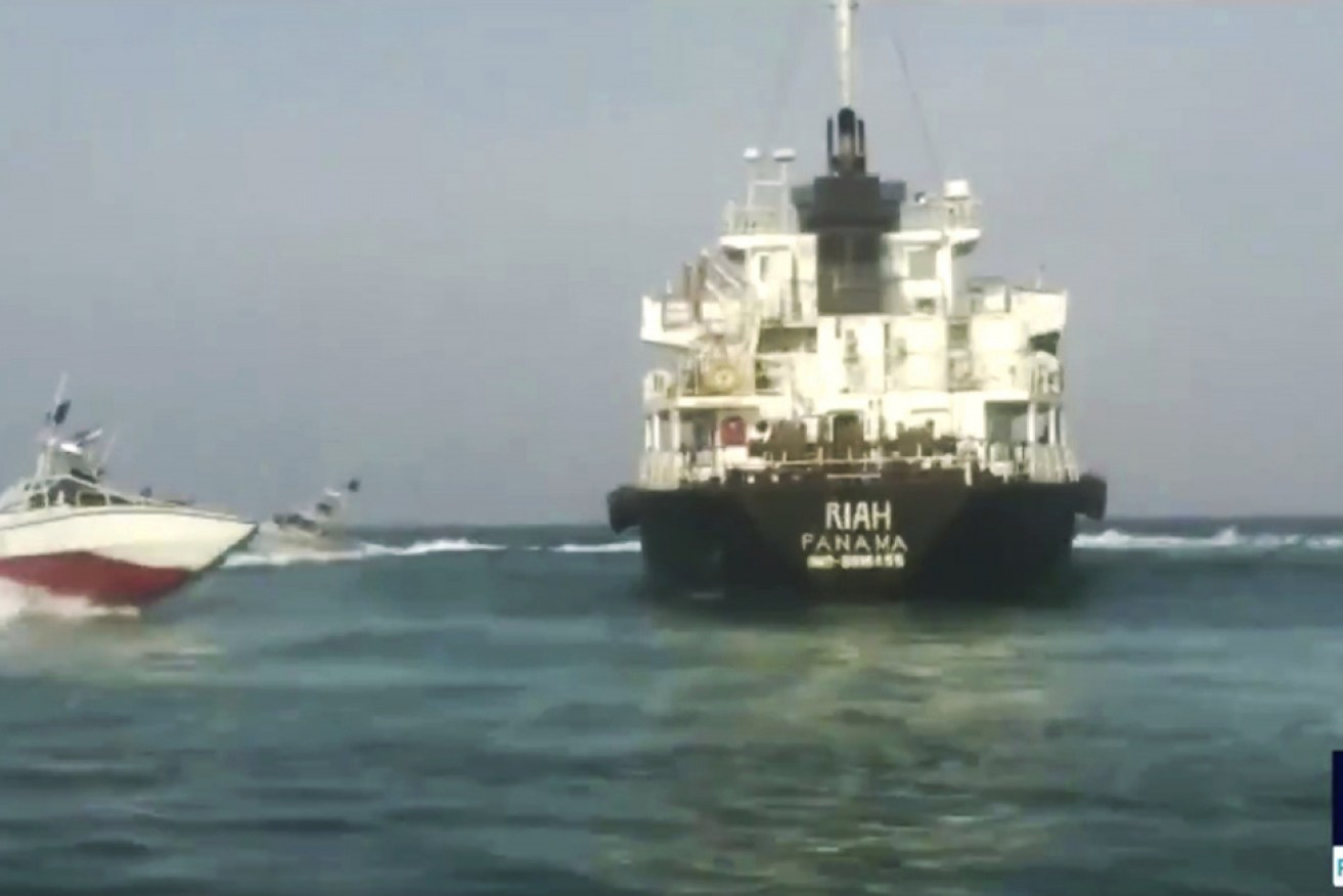 The Panamanian-flagged oil tanker MT Riah (pictured) surrounded by Iranian Revolutionary Guard vessels.