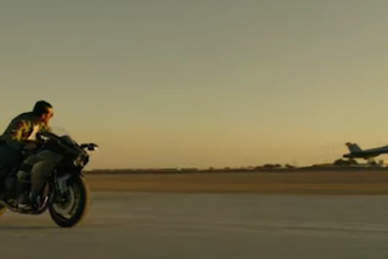 Yes, Tom Cruise (Maverick) races a plane on a motorbike in <i>Top Gun: Maverick.</i>