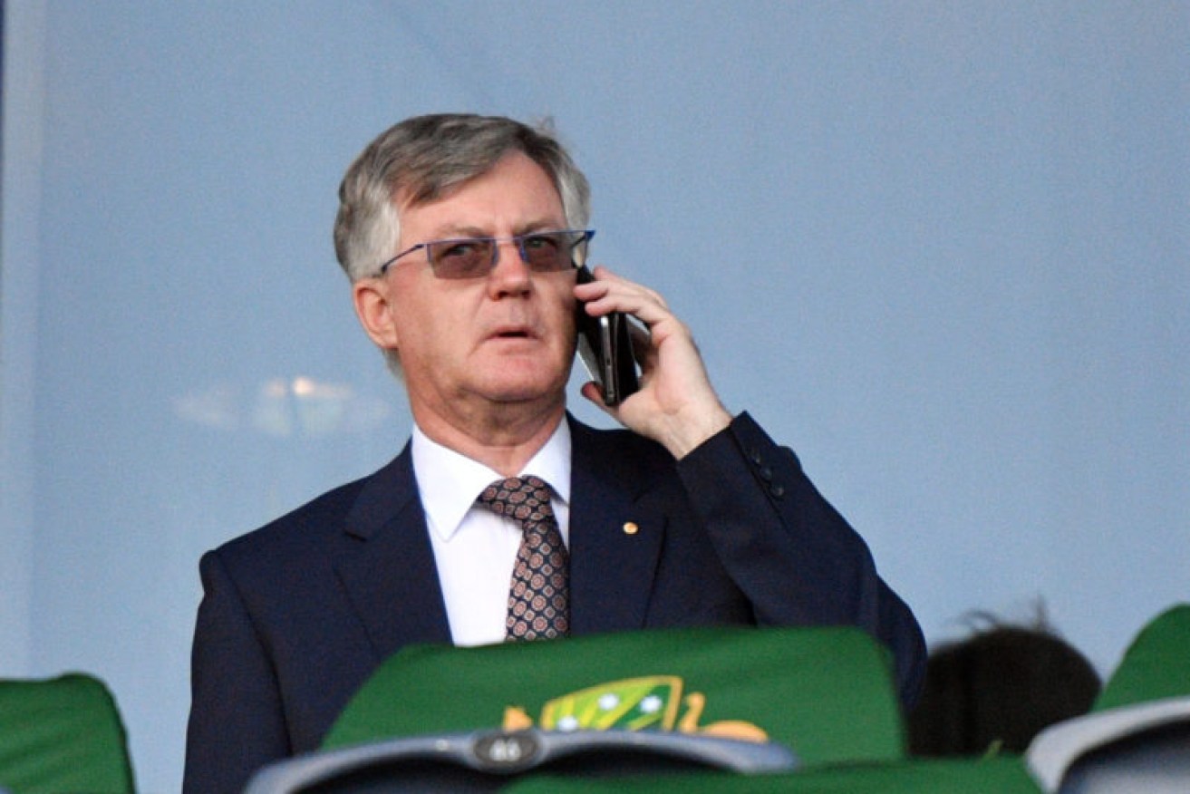 Australia's highest paid public servant Martin Parkinson checks into the office from the cricket.