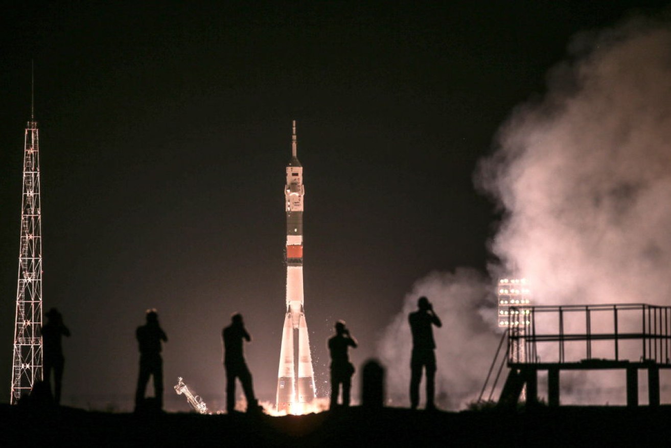 An international crew has blasted off on the 50th anniversary of the moon landing. The Soyuz capsule will make four orbits of the International Space Station. 
