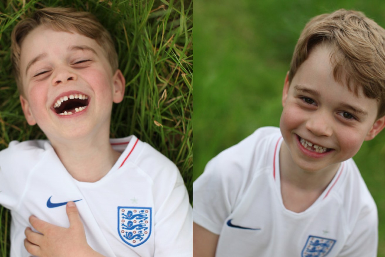 Prince George wears an England football shirt in two of the birthday shots, taken by his mother, Kate Middleton.