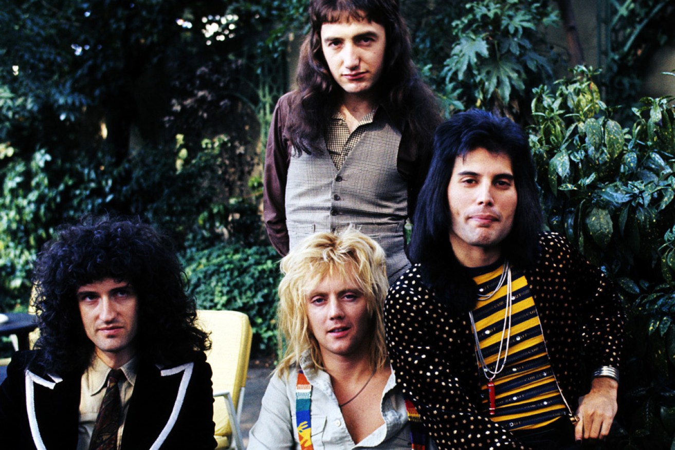Brian May, John Deacon, Roger Taylor and Freddie Mercury in 1976 celebrating one million record sales of <i>Bohemian  Rhapsody</i>. 