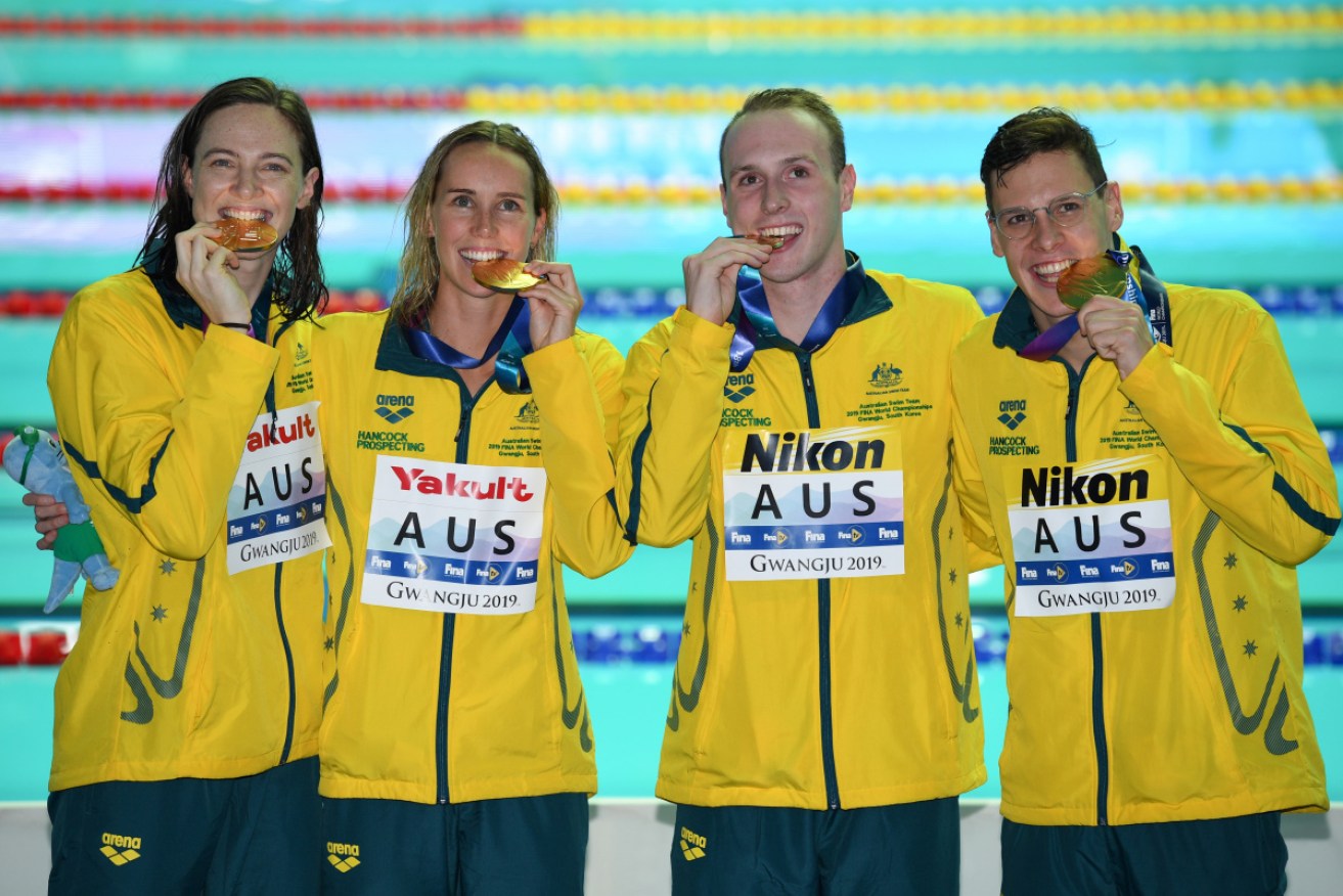 Emma McKeon, Cate Campbell, Mitchell Larkin and Matthew Wilson celebrate their mixed 4x100m medley relay win.  