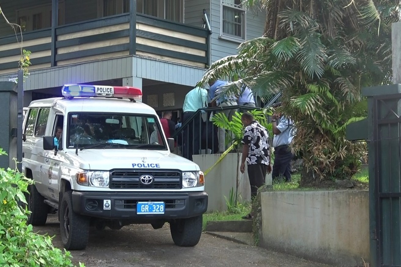 Police at Ms Downes' Suva home.