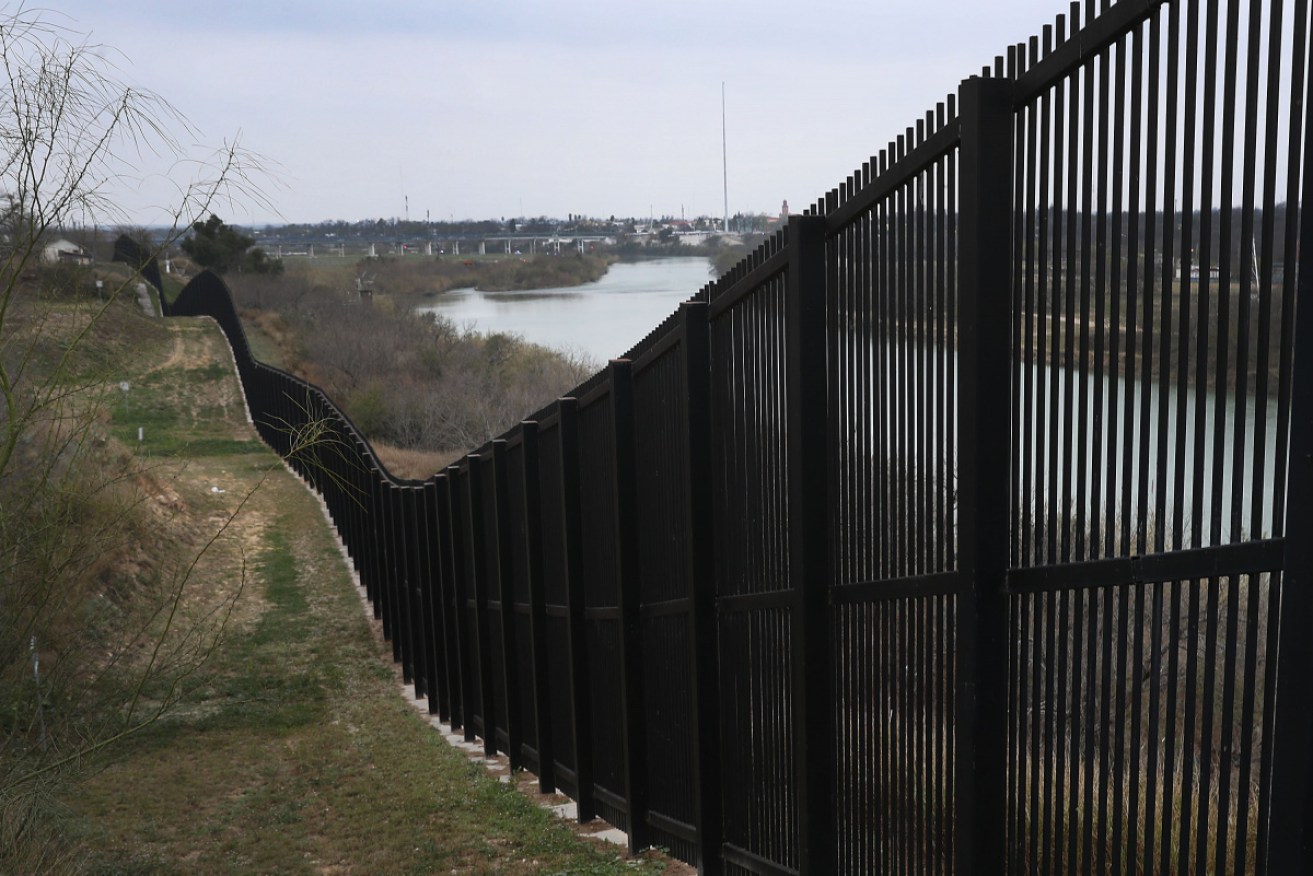 The decision to lift the freeze on funds means up to 160km of fencing along the Mexico border will be constructed.