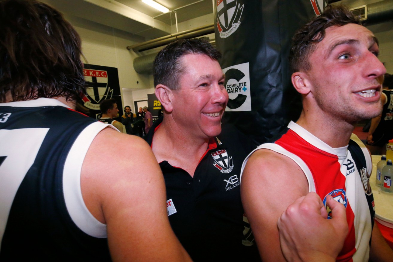 Smiles all round for the Saints as interim coach Brett Ratten joins his players in the rooms. 