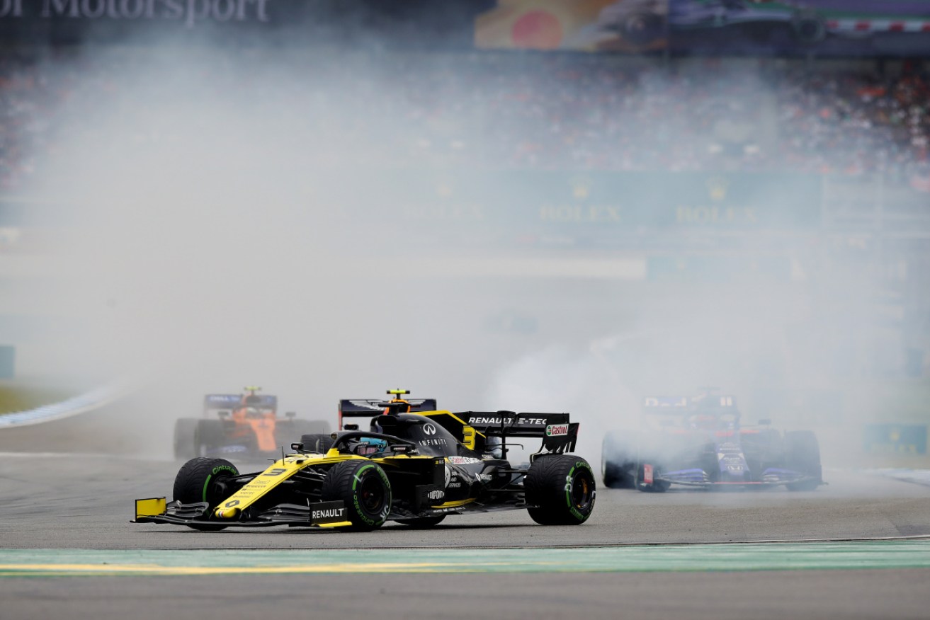 Daniel Ricciardo's Renault trails smoke after an exhaust failure. 