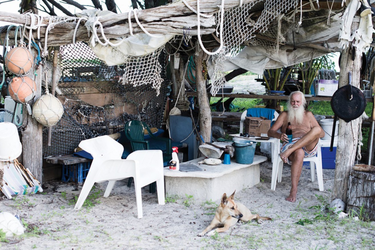 Castaway David Glasheen (in his Restoration Island shack) says young and older people should combine forces to "throw out the old establishment."