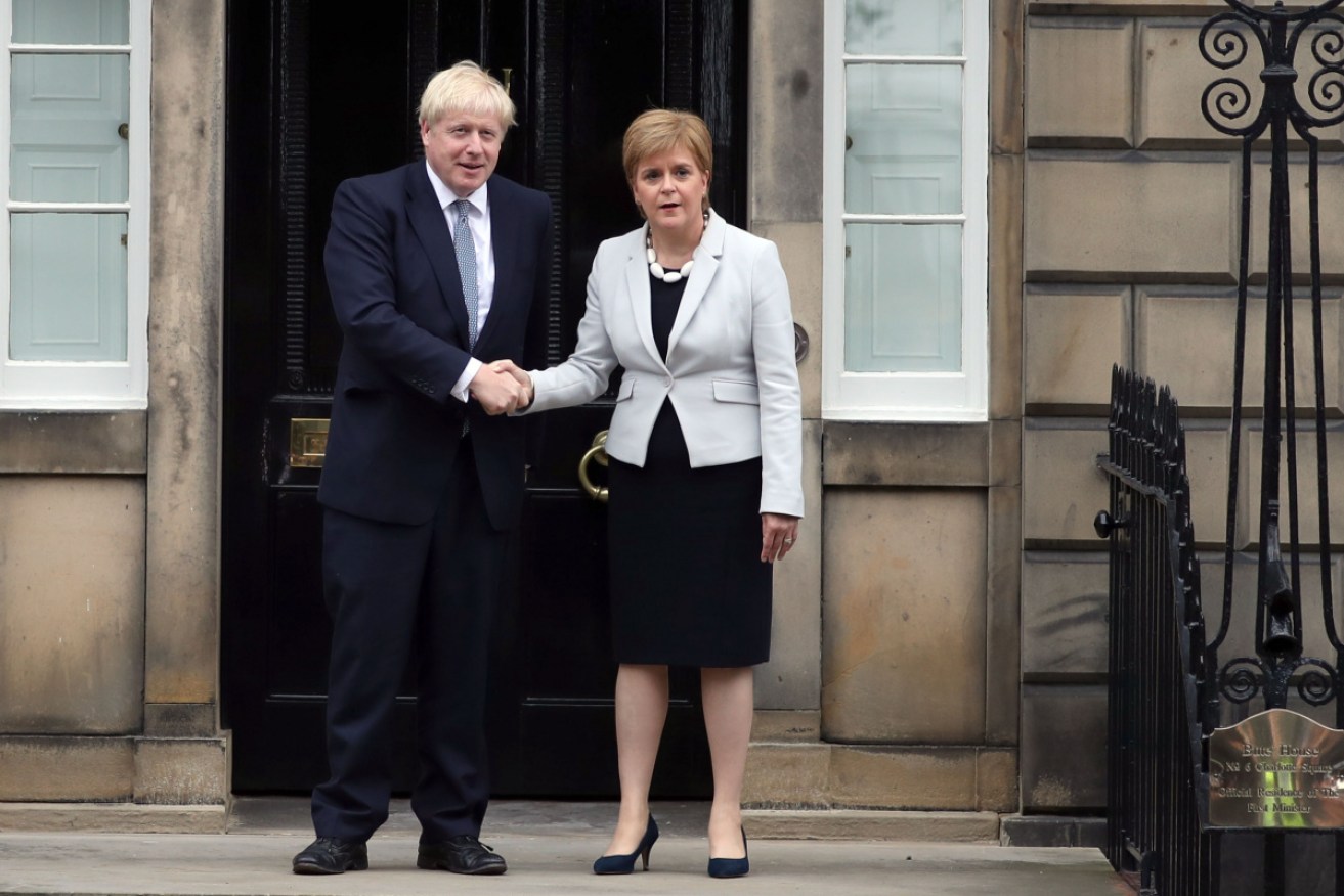 Scottish First Minister Nicola Sturgeon greets British PM Boris Johnson in Edinburgh.