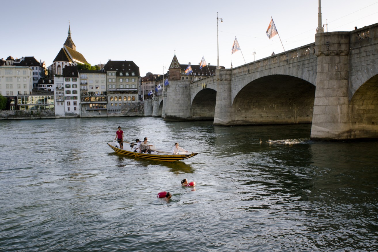 Workers in the Swiss town of Basel are commuting down the Rhine river to avoid Europe's stifling heat.