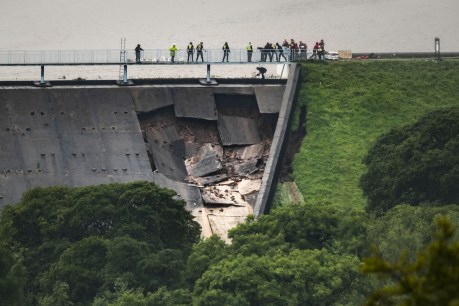 English town evacuated as dam wall partially collapses