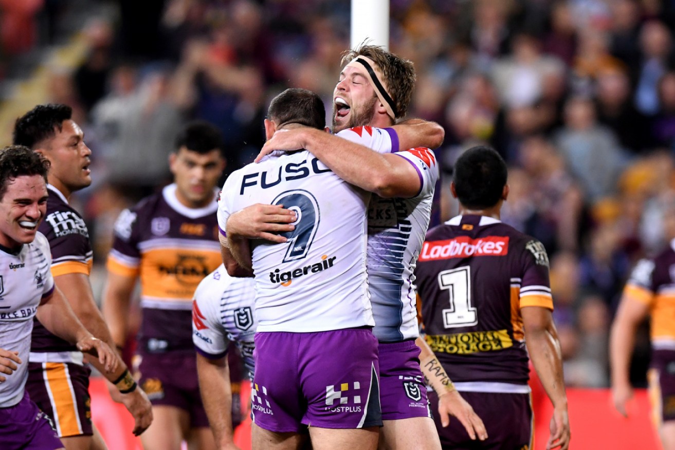 Storm's Christian Welch celebrating a try on Friday night before injury himself. 