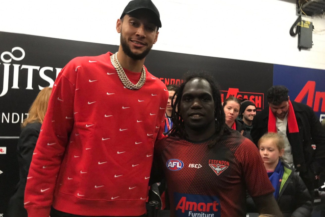 Ben Simmons with Essendon player Anthony McDonald Tipungwuti at Saturday's AFL match.