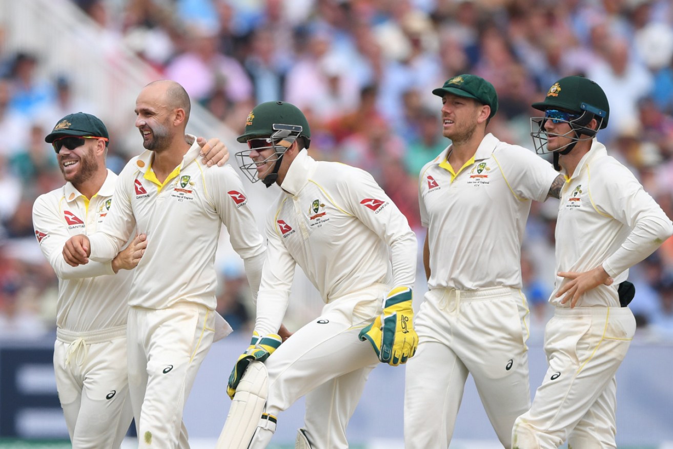 Nathan Lyon and his teammates celebrate after snaring Moeen Ali for a duck. 