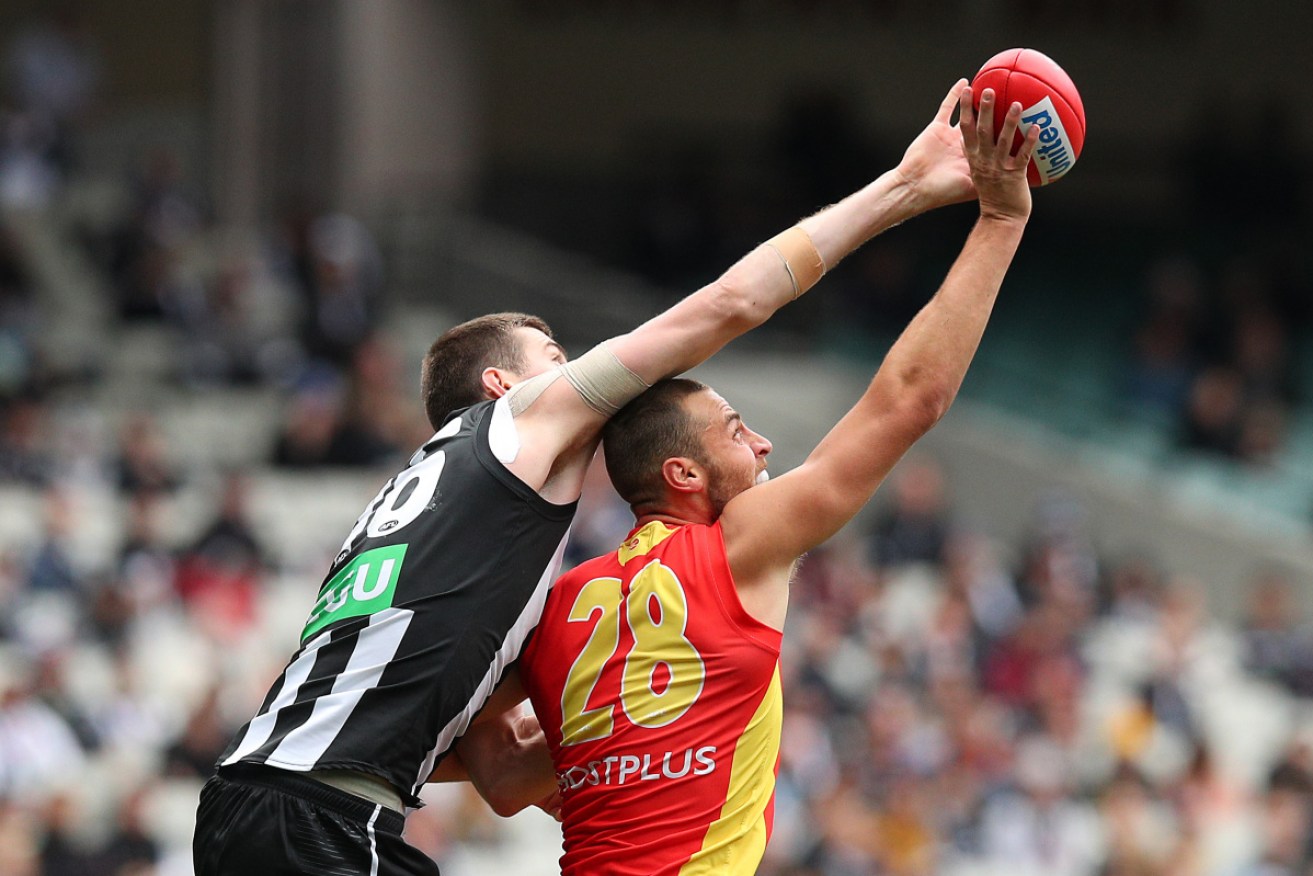 Collingwood's Mason Cox in action against Gold Coast before being poked in the eye. 