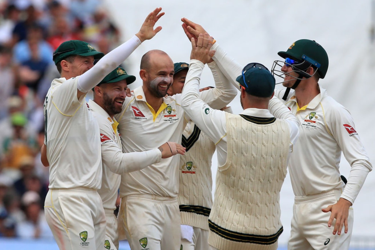Australia celebrates another wicket at the first Ashes Test, with Nathan Lyon claiming six wickets to help seal a win. 