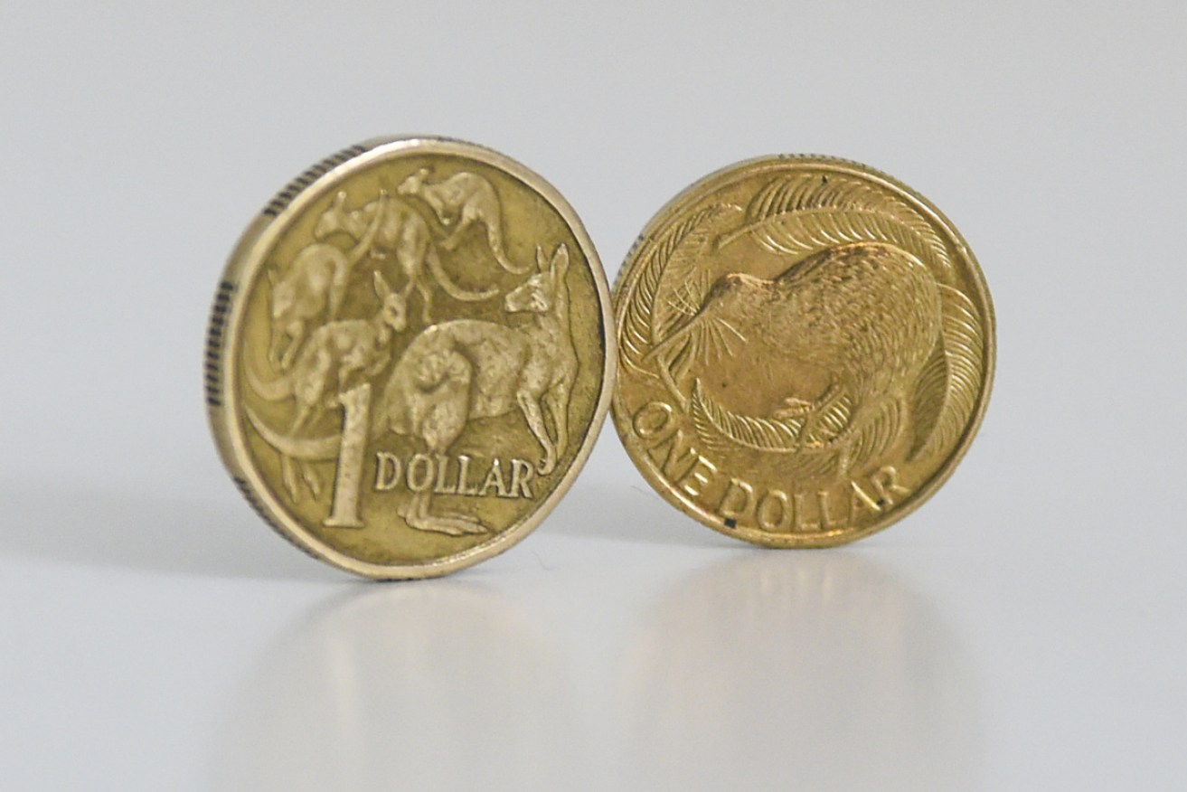 The Australian dollar plunged to a decade-low against the US currency after NZ's central bank moved on interest rates.