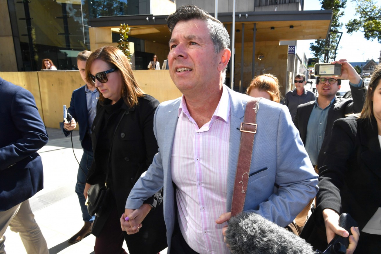 Former Ipswich mayor Andrew Antoniolli and his wife Karina leave court after he was sentenced on Friday.