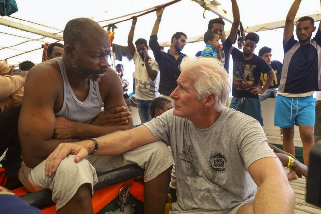 Gere spoke to several migrants who had escaped war-torn Libya, handing out food and supplies.