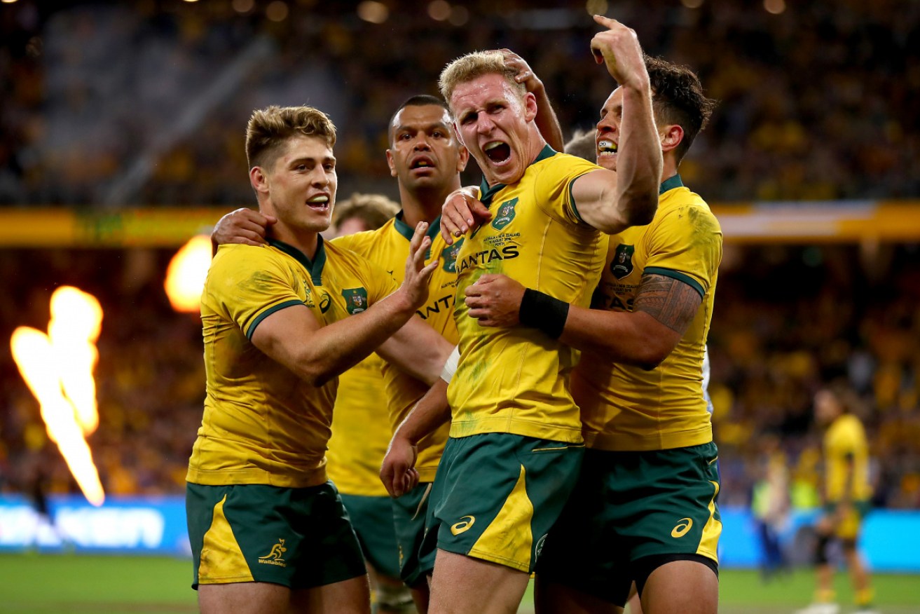 Reece Hodge (centre) is contending for the Wallabies' playmaker role at Suncorp Stadium again.