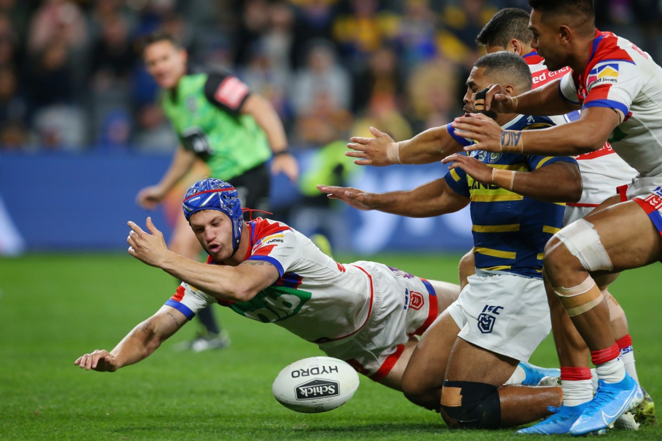Kalyn Ponga of the Knights fumbles the ball during the  match against the Eels. 