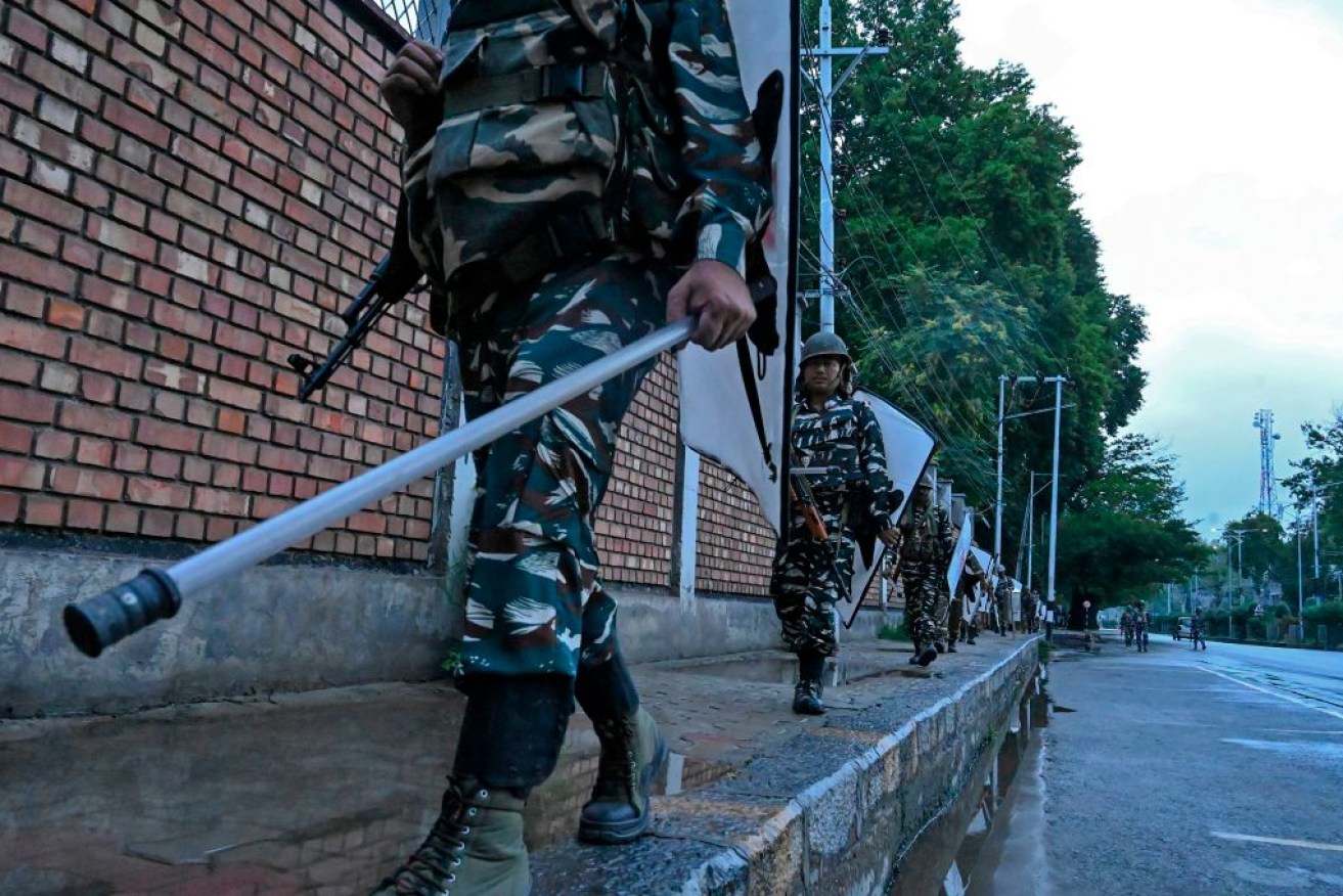 Security personnel patrol during a lockdown in Srinagar.