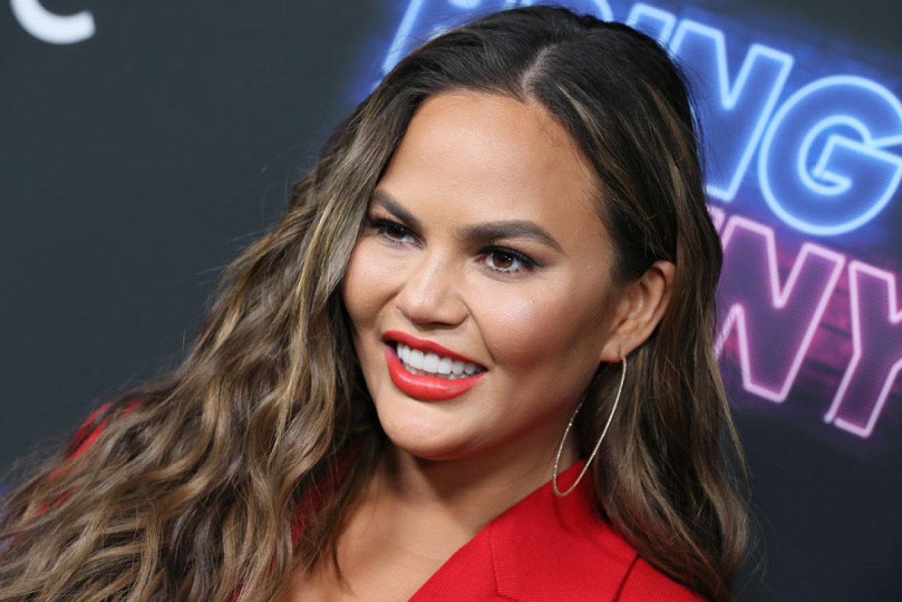 Chrissy Teigen (at a Los Angeles premiere on June 26) publicly supported the controversial lipstick.
