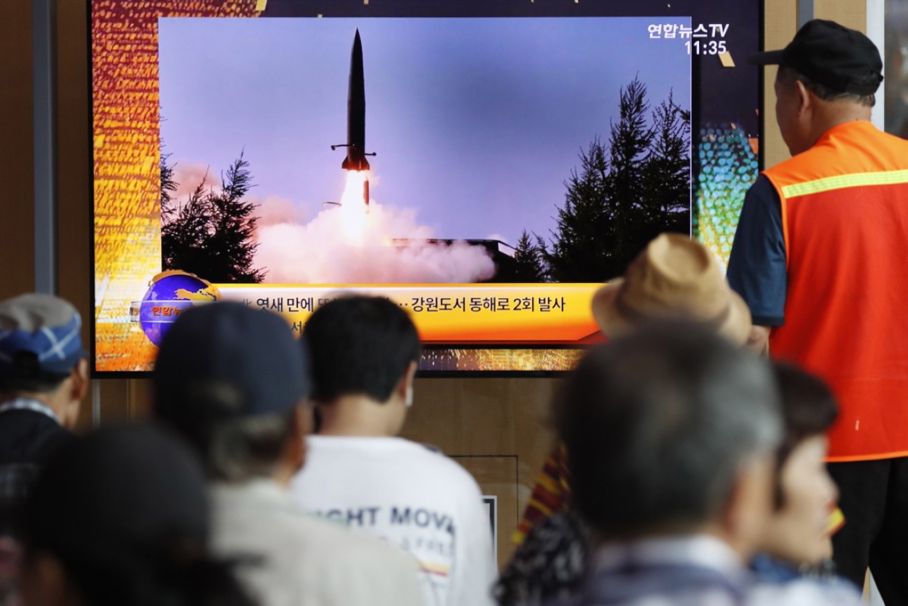 South Koreans watch a breaking news report about North Korea's latest missile launch.