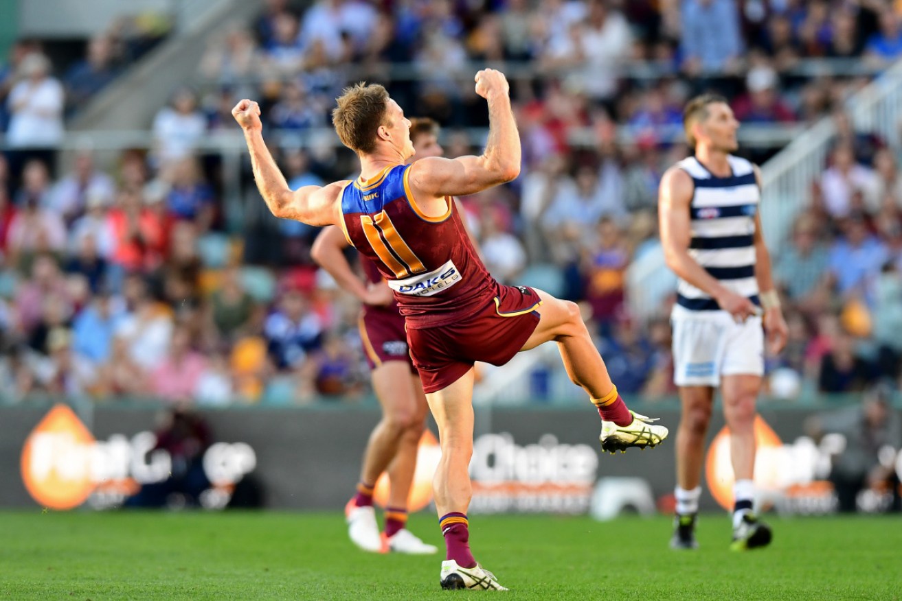 Brisbane Lions Lincoln McCarthy watching his winning goals sial through to sink the Cats. 