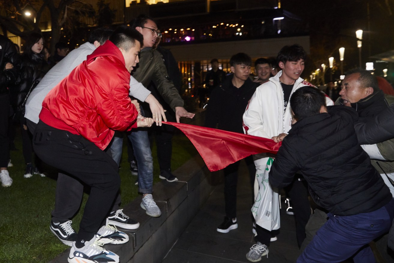 Pro-Hong Kong and pro-China protesters clash over a flag in Melbourne on August 16.