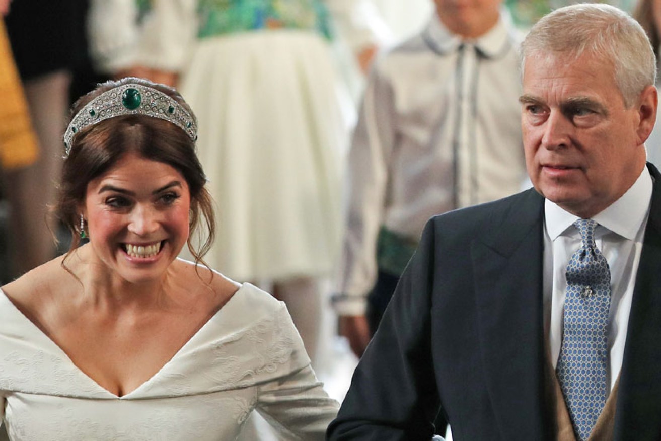 Prince Andrew escorts daughter Princess Eugenie at her October 12, 2018 wedding to Jack Brooksbank at Windsor Castle. 