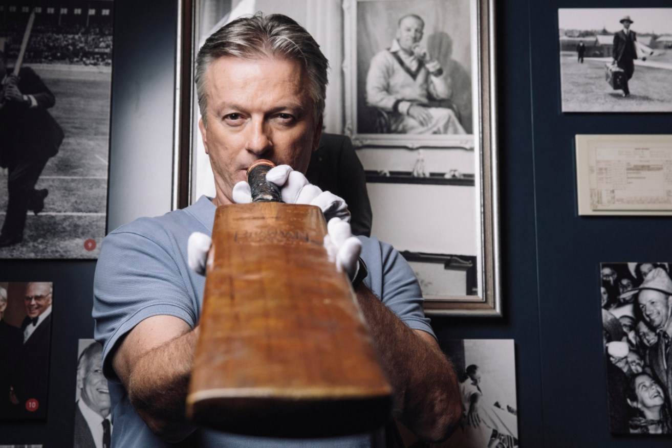 Cricket great Steve Waugh with Don Bradman's bat.