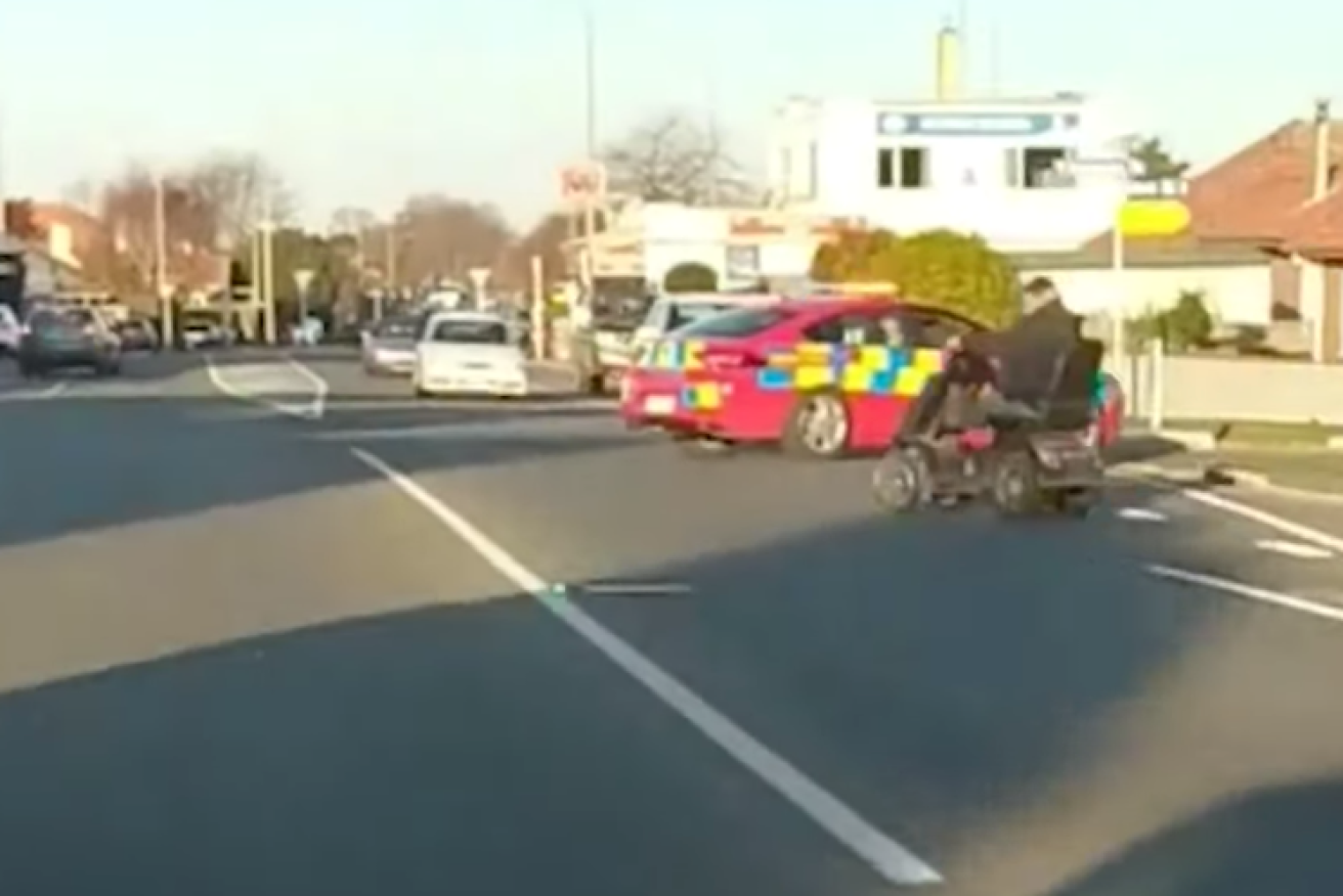A passing motorist captured a slow-speed police pursuit of a man on a mobility scooter in Timaru, New Zealand.