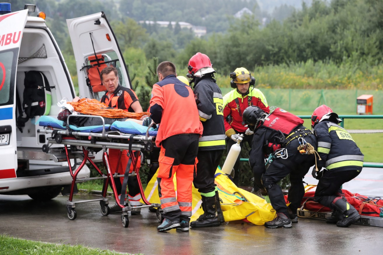 An injured tourist is transported to hospital after the deadly Tatra mountains lightning strike.
