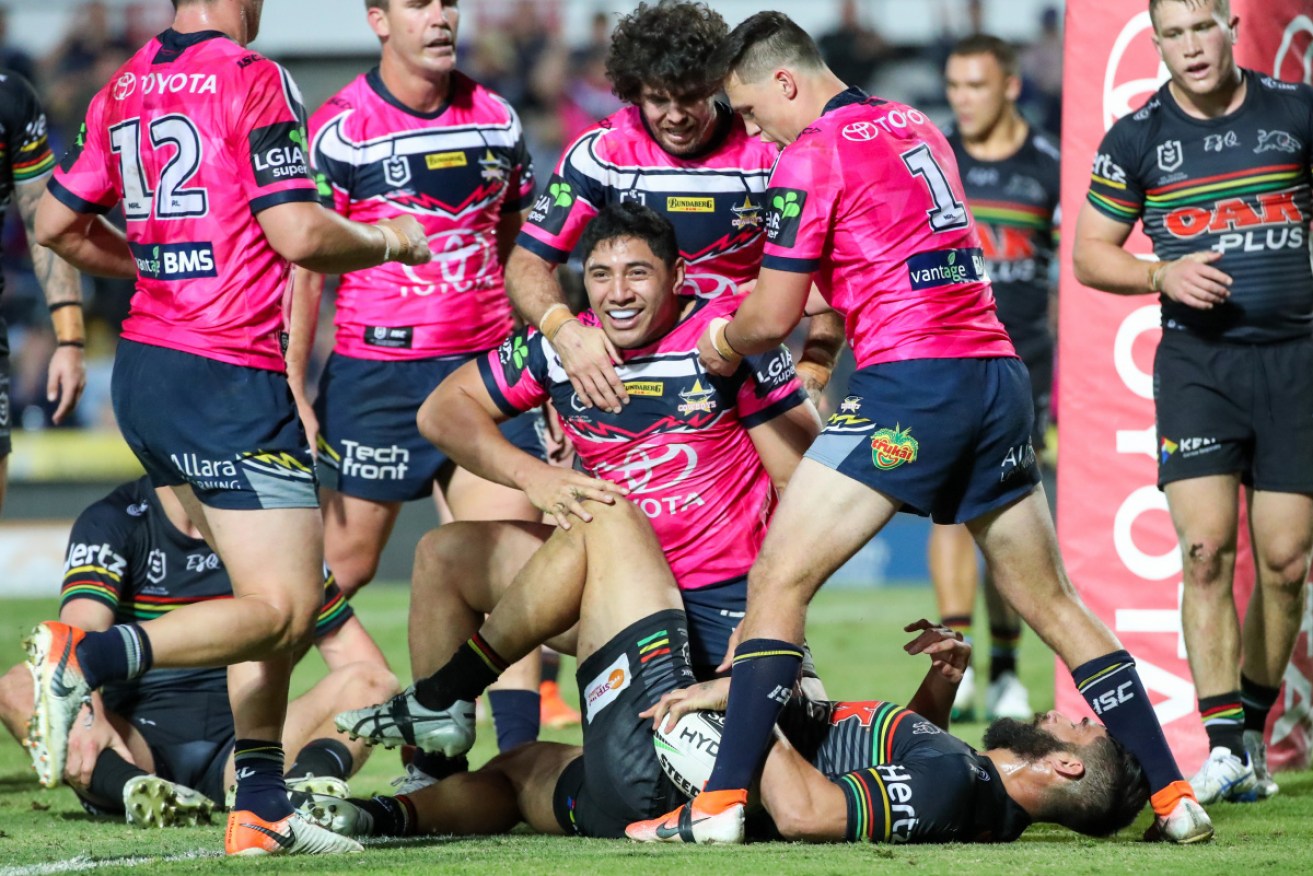 Jason Taumalolo of the Cowboys scores a try during the Round 23 NRL match.